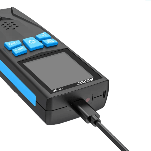 Paint Thickness Gauge CT02C connected to a charging cable, with battery status displayed on the screen.