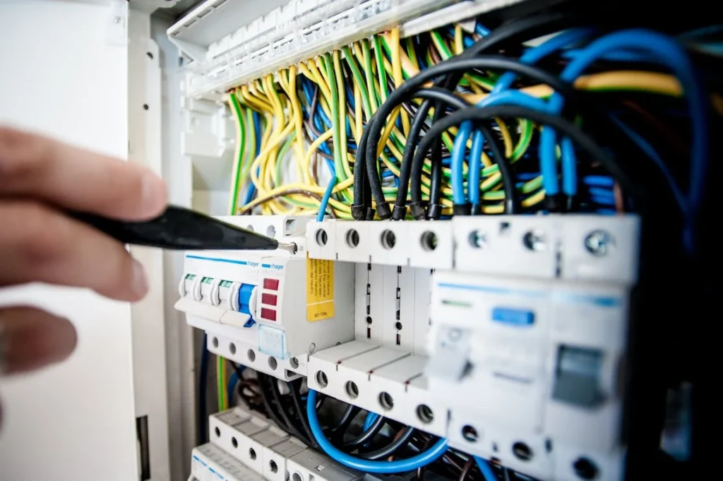 Electrician fixing up a breaker