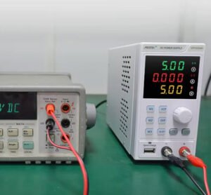 The image shows a DC power supply being tested.